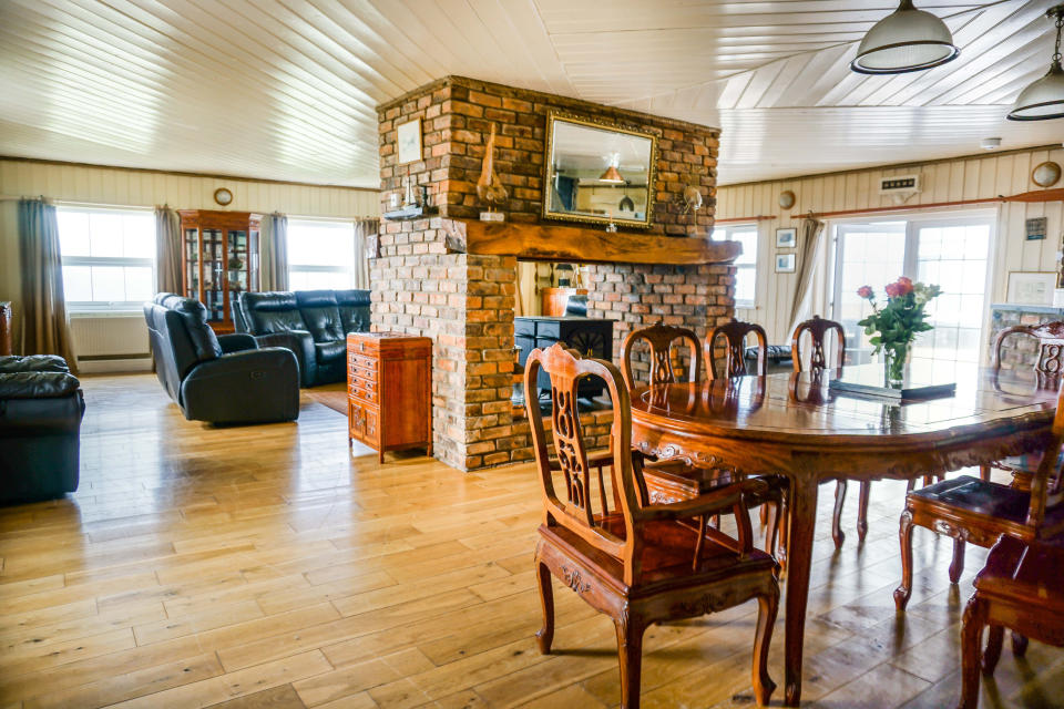 The open plan ground floor centres around a brick fireplace. (Purple Bricks)