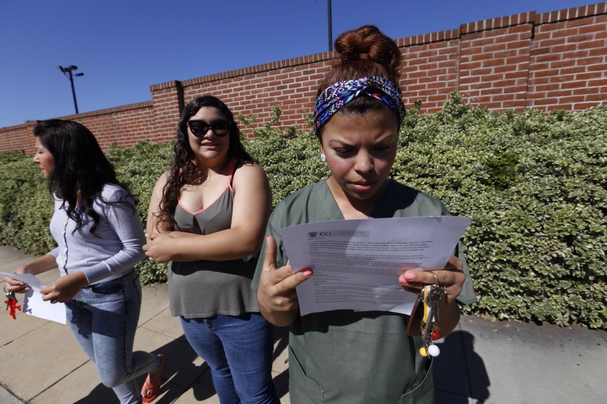 ALHAMBRA, CA - APRIL 27: Ruby Maldanado, 20, a Medical Assistant student checks a note handed out to students that have been turned away at the gate to Everest College on April 27, 2015 in Alhambra, California. Corinthian Colleges Inc., a Santa Ana company that was once one of the nation's largest for-profit college chains, announced that it would be shutting down its remaining two dozen schools effective - a move that leaves 16,000 students scrambling for alternatives. (Photo by Al Seib / Los Angeles Times via Getty Images)