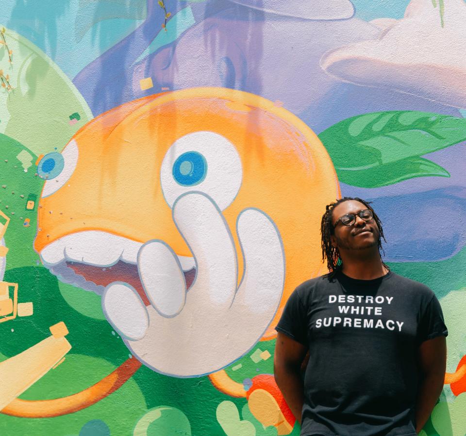 Cunabear in front of a Starland Mural Project piece created by José Ray.