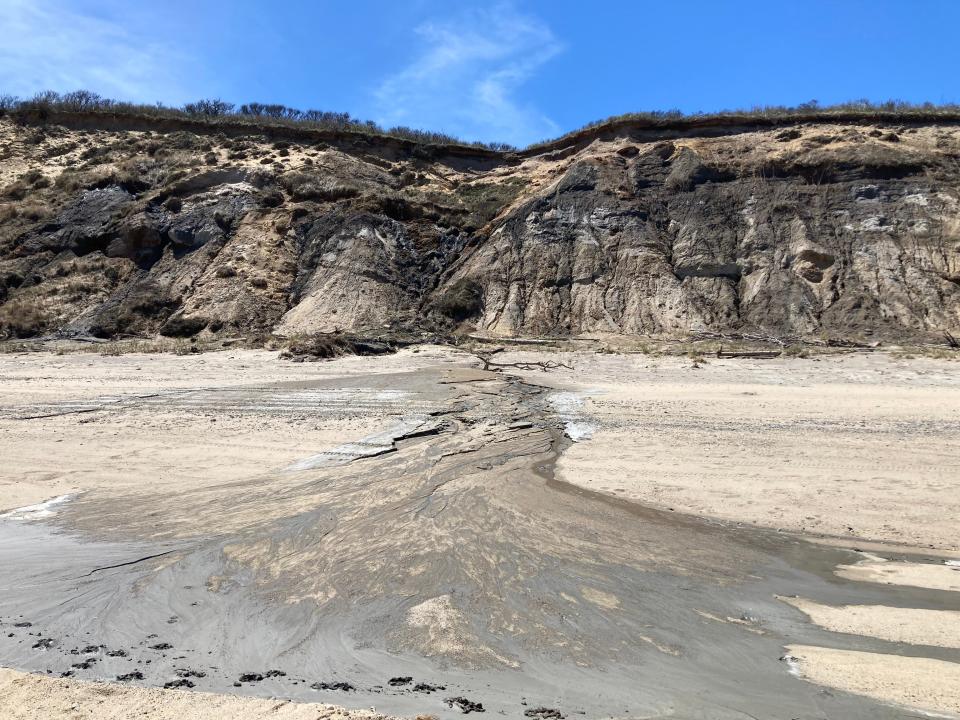 Water flows out of the cliffs in several locations south of Coast Guard Beach in Truro, carving a little riverbed in the sand.