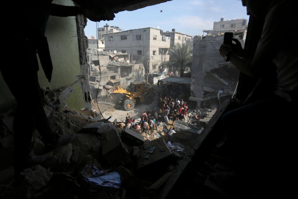 Palestinians look for survivors fter an Israeli strike on the Gaza Strip in Rafah on Monday (Copyright 2023 The Associated Press. All rights reserved.)