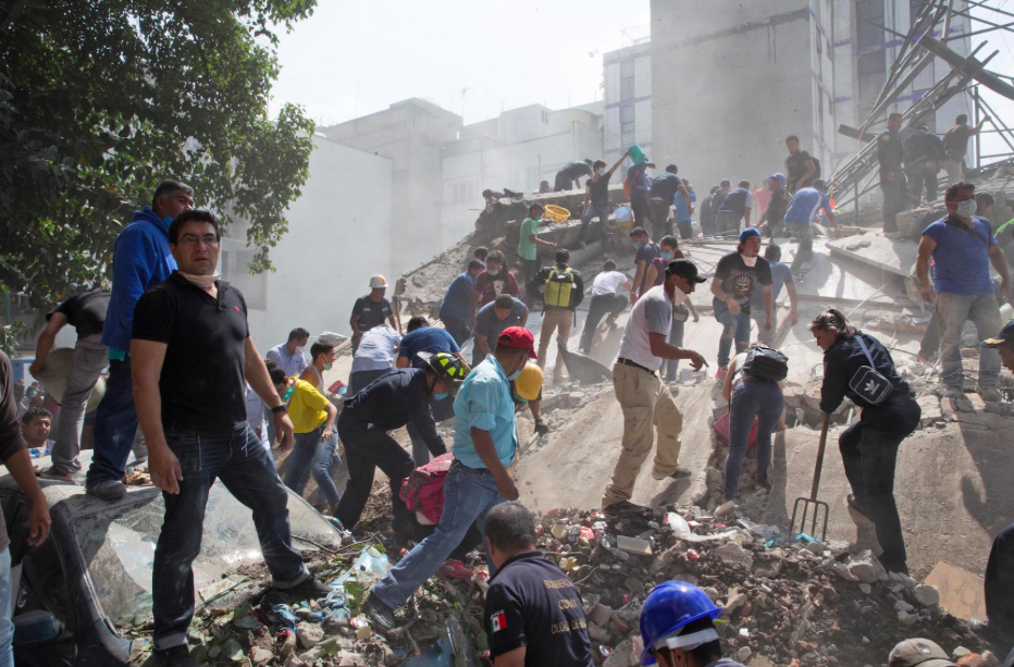 <em>Civilians have joined in with the rescue efforts (Rex)</em>