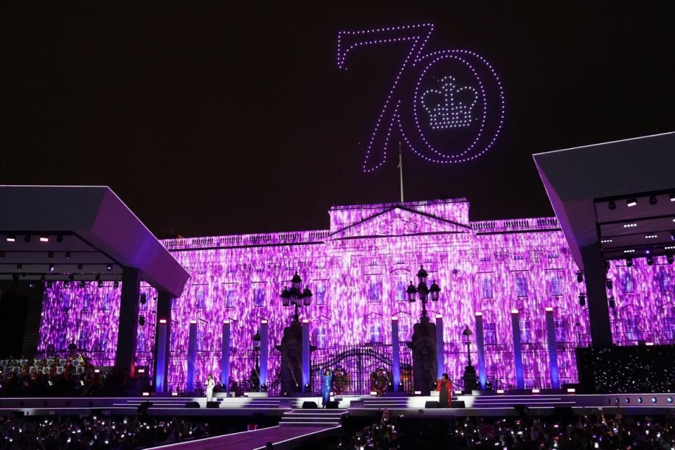 The number 70 lit up over the palace (PA)