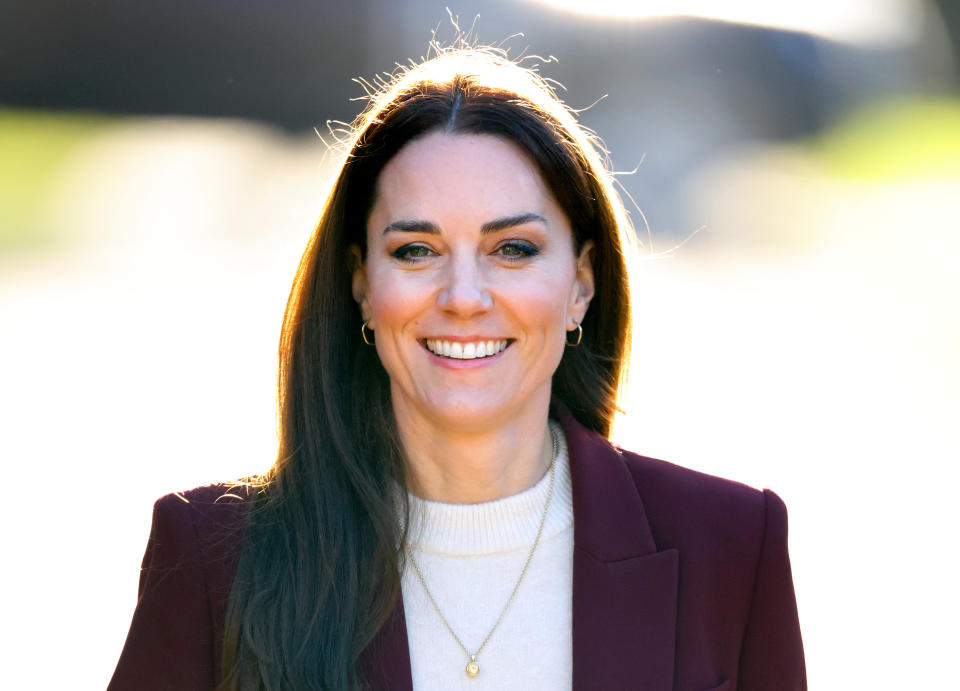 Kate Middleton wears burgundy blazer and white sweater