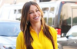 Sofia Vergara brings a little sunshine in a bright yellow button down and ripped jeans