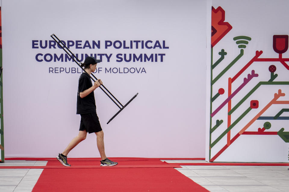 A man walks past banners during preparations at the Castel Mimi in Bulboaca, Moldova, Wednesday, May 31, 2023. Moldova will host the Meeting of the European Political Community on June 1, 2023. Preparations for a major summit of European leaders were still underway in Moldova on Wednesday, a sign of the Eastern European country’s ambitions to draw closer to the West and break with its Russian-dominated past amid the war in neighboring Ukraine. (AP Photo/Andreea Alexandru)