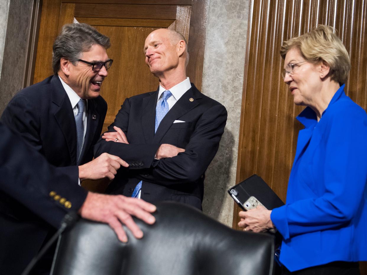 From left, Energy Secretary Rick Perry Sens. Rick Scott, R-Fla., and Elizabeth Warren, D-Mass, talk before Senate Armed Committee confirmation hearing titled "The Department of Energy's Atomic Energy Defense Programs," in Dirksen Building on Thursday, March 28, 2019.