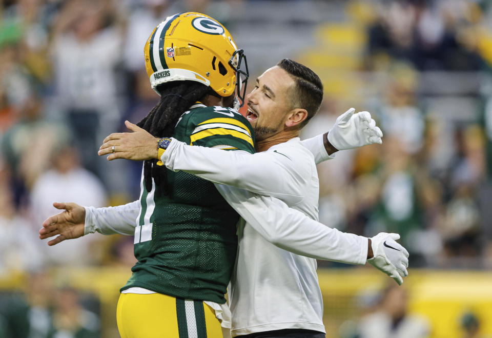 Green Bay Packers head coach Matt LeFleur hugs Sammy Watkins before their game against the Chicago Bears on Sunday, Sept. 18, 2022, in Green Bay, Wis. Watkins is the Packers’ leading receiver and caught three passes for 93 yards in a Sunday night victory over the Chicago Bears. (AP Photo/Jeffrey Phelps)