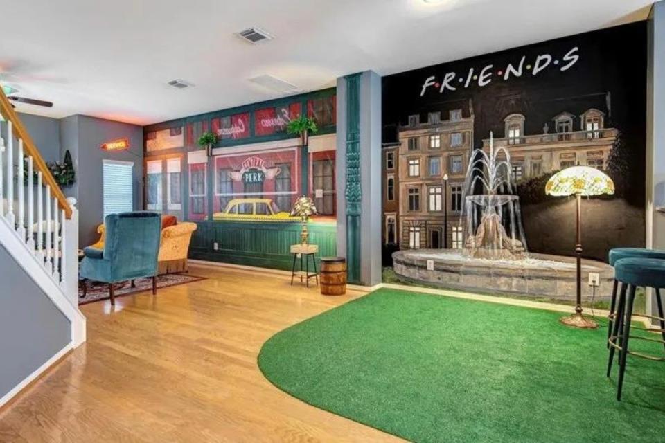 Friends-inspired home with fountain mural and coffee house