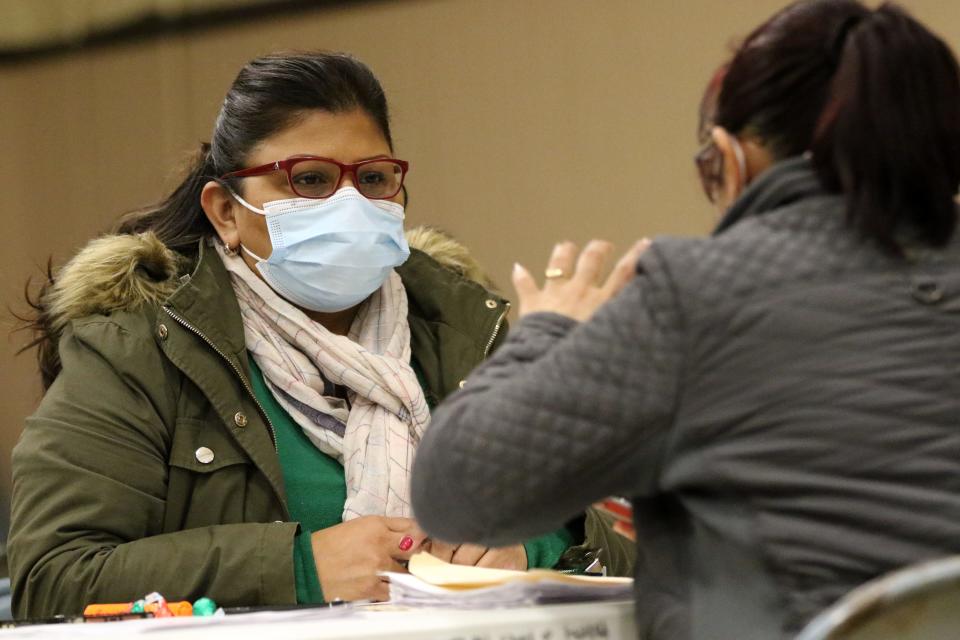 Nancy Vega, of Make the Road New Jersey, helps a person, who did not want to be identified, with an application to obtain money from the Excluded New Jersey Fund.  The fund was created for people who did not get unemployment and stimulus money. Tuesday, December 14, 2021