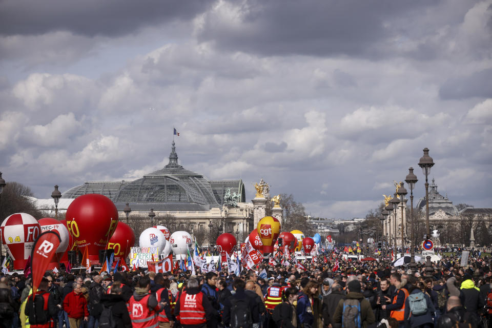 Protesters march during a demonstration in Paris, France, Wednesday, March 15, 2023. Opponents of French President Emmanuel Macron's pension plan are staging a new round of strikes and protests as a joint committee of senators and lower-house lawmakers examines the contested bill. (AP Photo/Thomas Padilla)