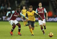 Britain Football Soccer - West Ham United v Arsenal - Premier League - London Stadium - 3/12/16 West Ham United's Arthur Masuaku in action with Arsenal's Alex Oxlade-Chamberlain Action Images via Reuters / John Sibley Livepic