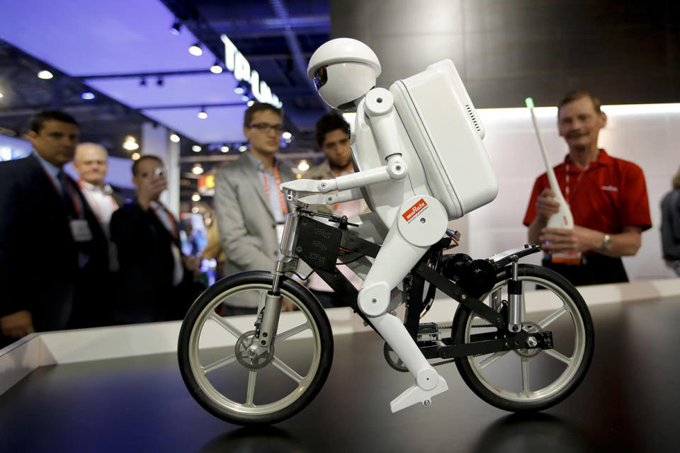 Murata Boy, a bicycle riding robot, rides a bike at the Murata booth at the at the International Consumer Electronics Show.