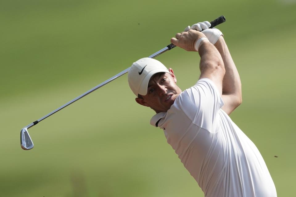 Rory McIlroy of Northern Ireland plays his second shot on the 18th hole hole during the final round of the DP World Tour Championship golf tournament, in Dubai, United Arab Emirates, Sunday, Nov. 19, 2023. (AP Photo/Kamran Jebreili)