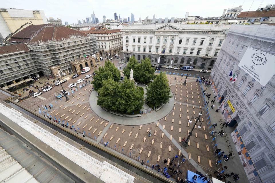 La Scala theatre square is filled with 172 coffins, as many as the number of deaths at work that Lombardy recorded in 2023, during a flash mob organised by UIL trade union organization, in Milan, Italy, Friday, May 10, 2024. (AP Photo/Luca Bruno)