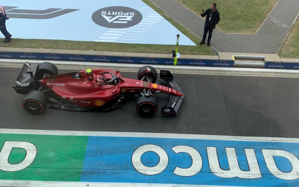 A Ferrari leaves the pit lane - Telegraph