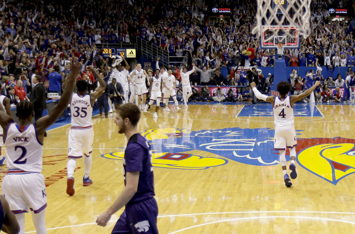 Kansas celebrates after Barry Brown Jr. misses the game-winning shot for Kansas State in Allen Fieldhouse. (AP Photo)