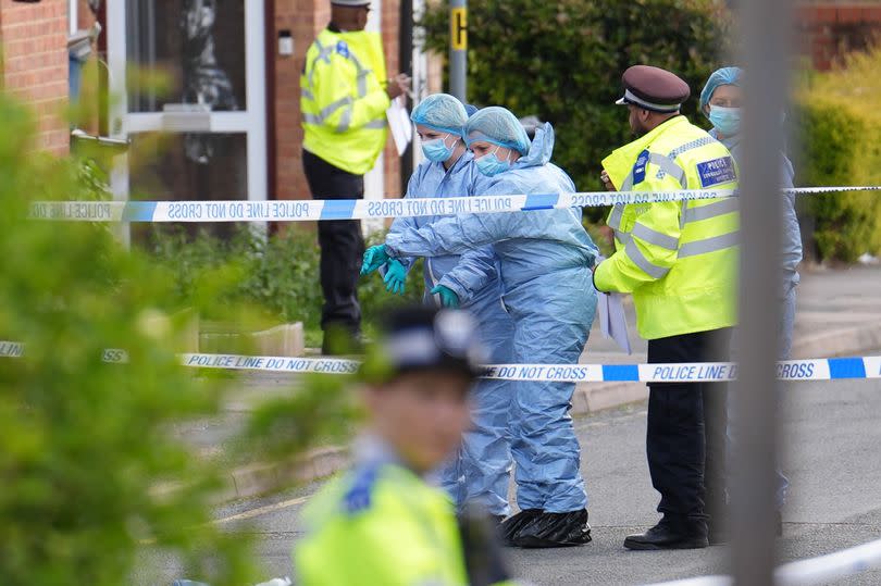 Forensic investigators in Laing Close in Hainault, in North East London, after a 13-year-old boy died after being stabbed and a sword-wielding man arrested following an attack on members of the public and two police officers. Picture date: Tuesday April 30, 2024