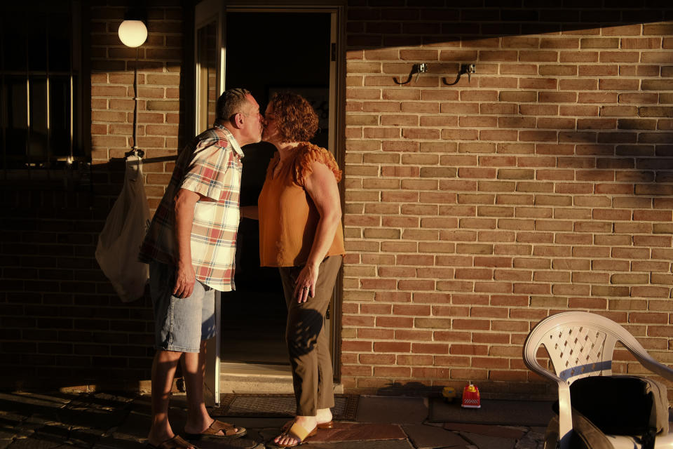 Mayor Eddie Moran kisses his wife, Ruth Moran, during a family BBQ held at his sister's home in Reading, Pa., on Sunday, June 16, 2024. “Right now, with the growing Latino population and the influx of Latinos moving into cities such as Reading, it’s definitely an opportunity for the Latino vote to change the outcome of an election," the mayor says. “It's not a secret anymore.” (AP Photo/Luis Andres Henao)