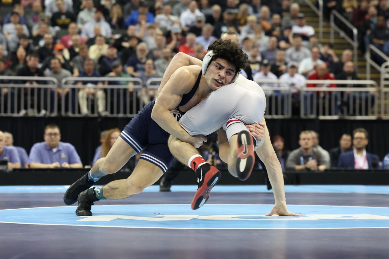 Mar 23, 2024; Kansas City, MO, USA; At 141 pounds Ohio State Buckeyes wrestler Jesse Mendez competes against Penn State Nittany Lions wrestler Beau Bartlett. Mandatory Credit: Reese Strickland-USA TODAY Sports