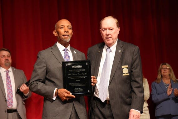 Cumberland County Schools Superintendent Dr. Marvin Connelly, left, poses Tuesday, Nov. 14, 2023, with his 2024 A. Craig Phillips NC Superintendent of the Year plaque alongside Jack Hoke, the executive director of the NC School Superintendents Association.