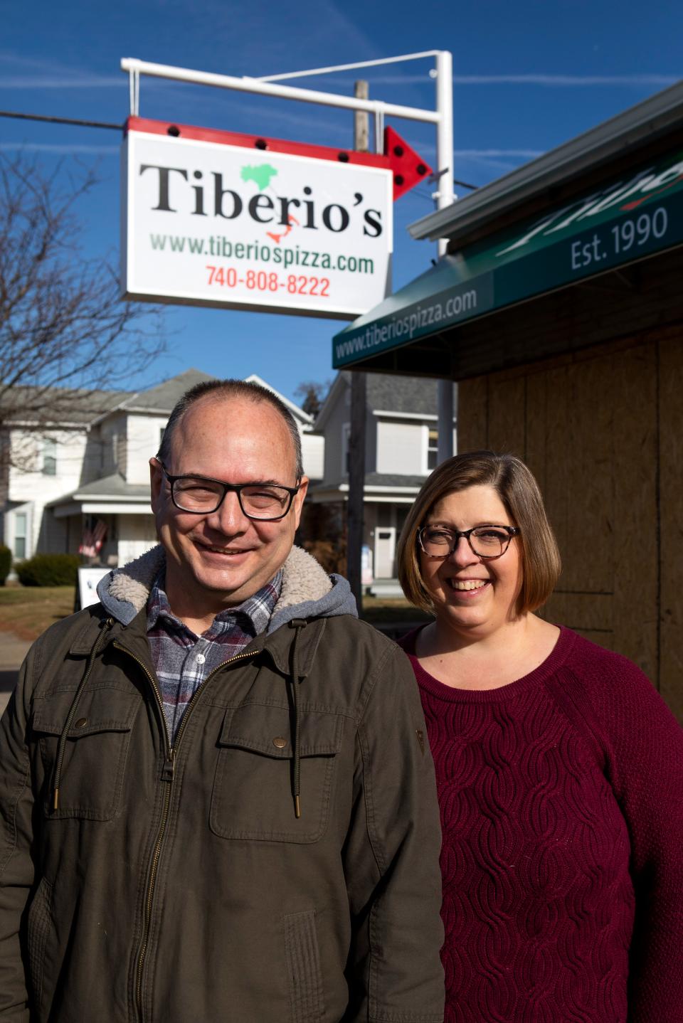 Bob and Maggie Bennett, the new of Tiberio's Pizza, stand outside of the new location on Columbus Rd. on Dec. 5, 2022 in Lancaster, Ohio. 