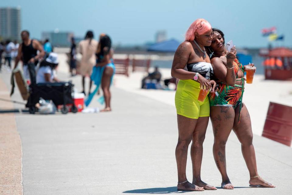 Spring breakers take photos during Black Spring Break in Biloxi on Saturday, April 13, 2024