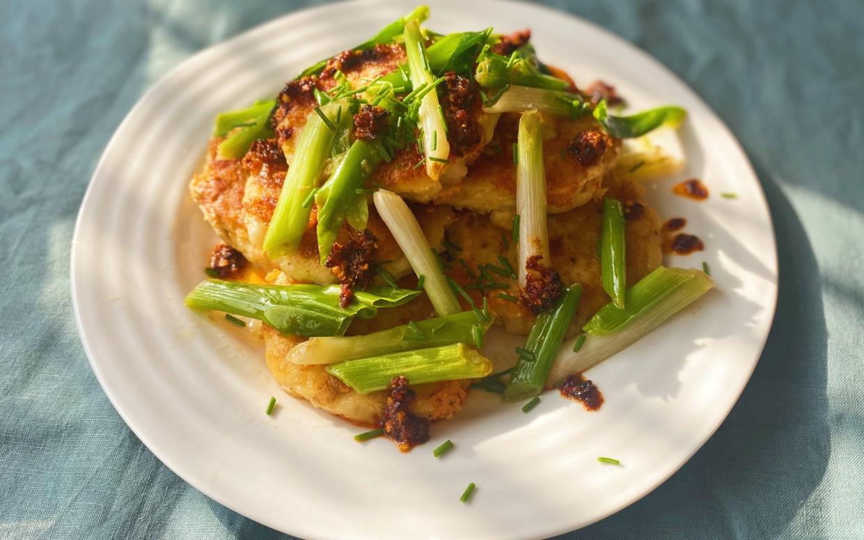 Cheesy potato cakes with brown-butter spring onions and crispy chilli - Eleanor Steafel