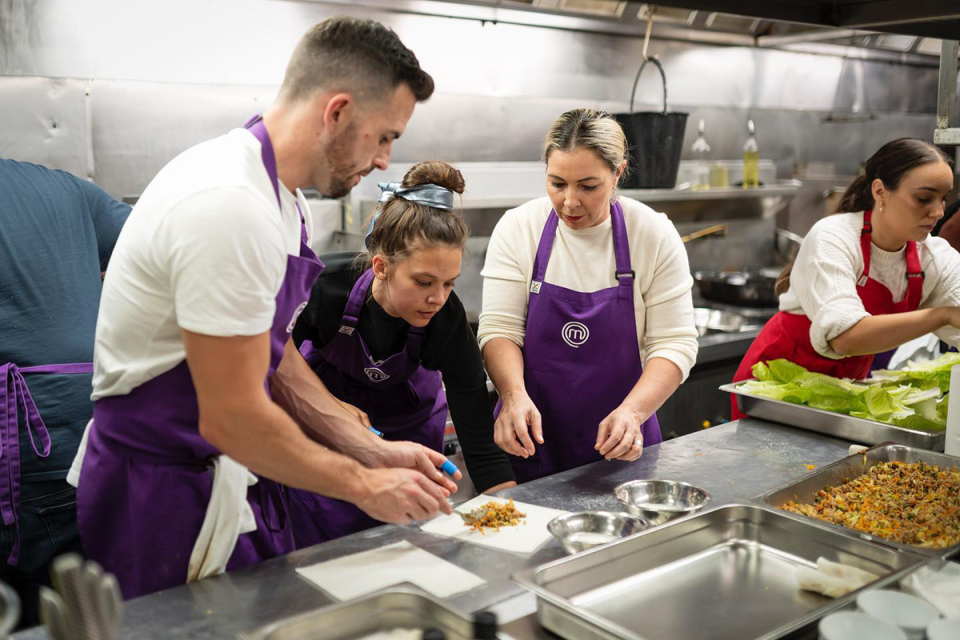 MasterChef contestants cooking.