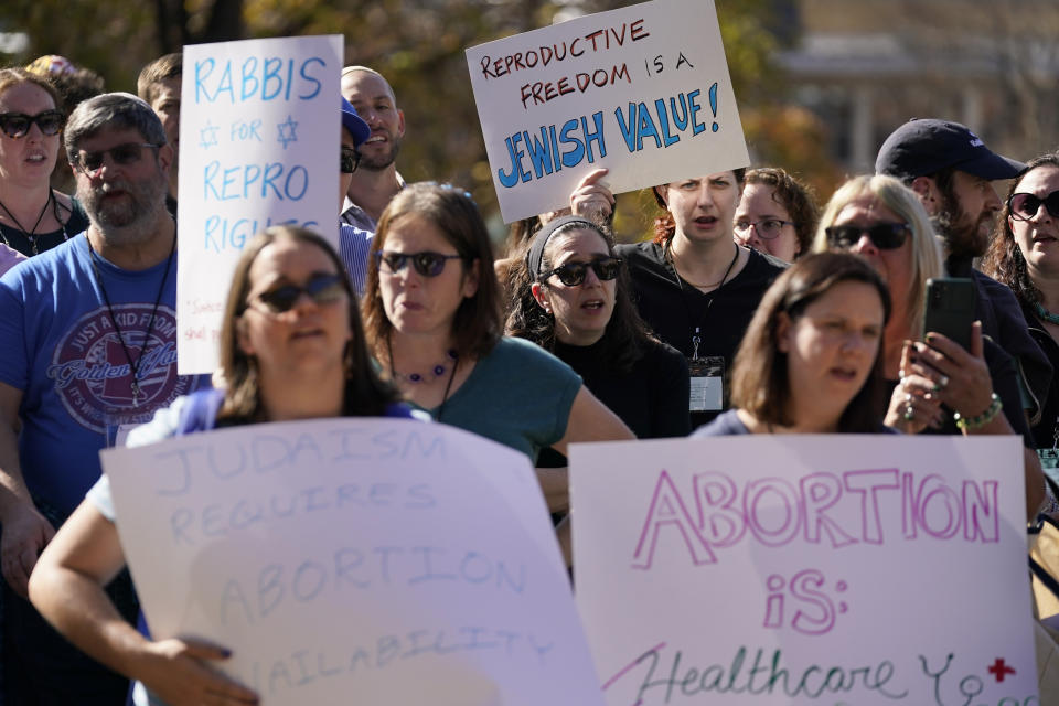 Rabbis and supporters from around the country gather for a rally, one day after the midterm elections, to show their support for protecting abortion rights Wednesday, Nov. 9, 2022, in Clayton, Mo. Participants in the rally advocated that abortion access is established by Jewish law and fundamental to religious freedom. (AP Photo/Jeff Roberson)