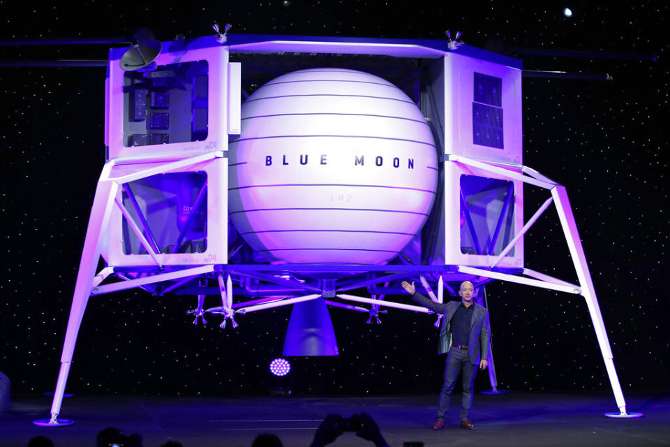 Jeff Bezos speaks in front of a model of Blue Origin’s Blue Moon lunar lander in Washington - Credit: AP