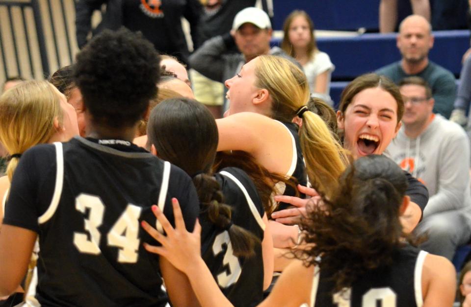 The West Ottawa girls basketball team celebrates winning the Division 1 regional championship on Wednesday, March 13, 2024, at Hudsonville.