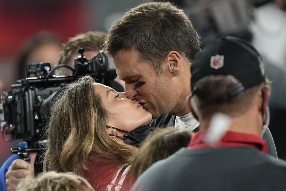 FILE - Tampa Bay Buccaneers quarterback Tom Brady kisses wife Gisele Bundchen after defeating the Kansas City Chiefs in the NFL Super Bowl 55 football game Sunday, Feb. 7, 2021, in Tampa, Fla. The Buccaneers defeated the Chiefs 31-9 to win the Super Bowl. The couple announced Friday they have finalized their divorce, ending their 13-year marriage. (AP Photo/David J. Phillip, File)