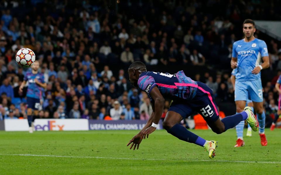 Leipzig's Nordi Mukiele scores an own goal and Manchester City's second goal - REUTERS/Craig Brough