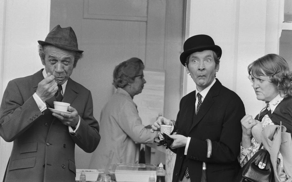 Sid James and Kenneth Williams take a tea-break in 1971 during the filming of Carry On at Your Convenience - Hulton