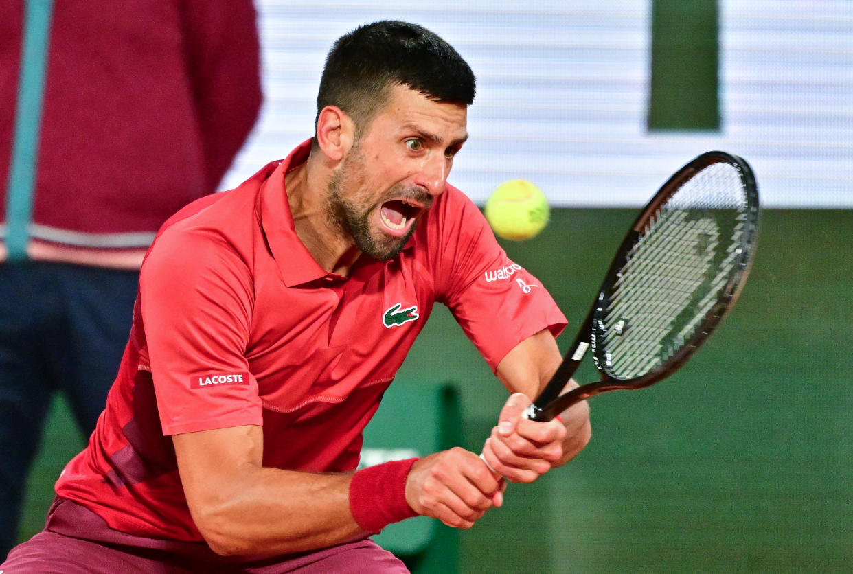 :PARIS, FRANCE - MAY 28: Novak Djokovic of Serbia hits a forehand in action against Pierre-Hugues Herbert of Franc in the first round of the men's singles at Roland Garros on May 28, 2024 in Paris, Francephoto by Christian Liewig - Corbis/Getty Images)