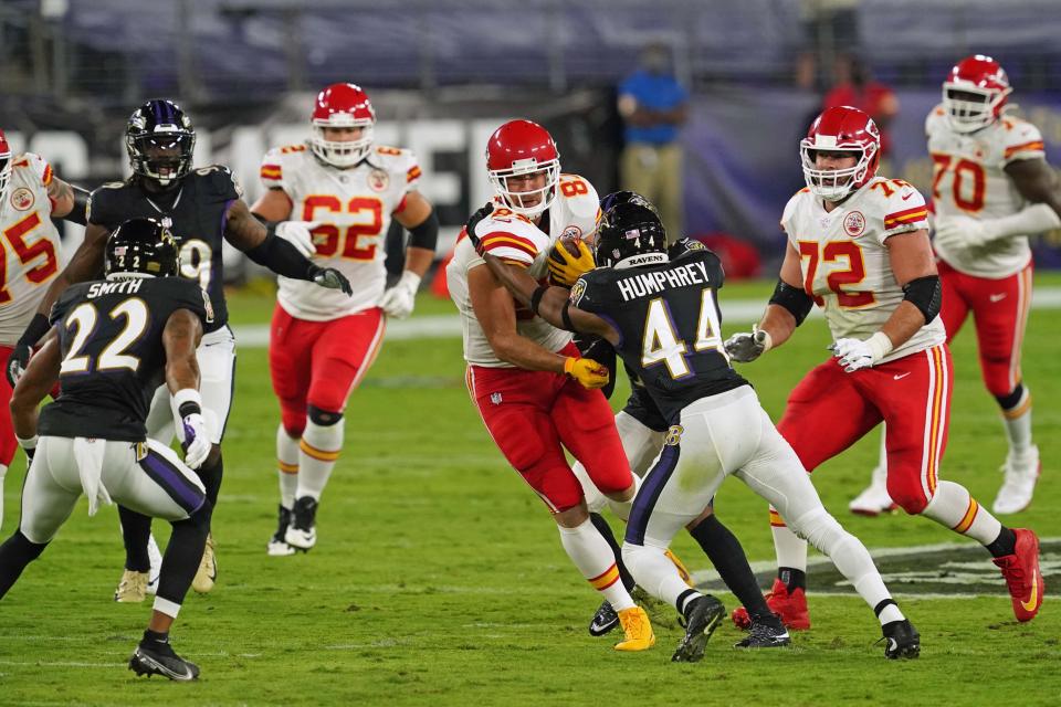 Sep 28, 2020; Baltimore, Maryland, USA; Kansas City Chiefs tight end Travis Kelce (87) is tackled after his catch in the first quarter by Baltimore Ravens cornerback Marlon Humphrey (44) at M&T Bank Stadium. Mandatory Credit: Mitch Stringer-USA TODAY Sports