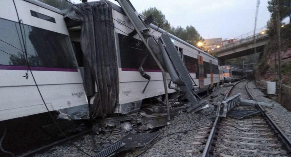 A passenger train after a collision with a landslide, near Vacarisses, some 45 kilometers northwest of Barcelona, Spain, Tuesday Nov. 20, 2018. One person died and dozens were injured Tuesday after a landslide derailed a commuter train traveling toward Barcelona, Spanish authorities said. (Anti-radar Catalunya via AP)