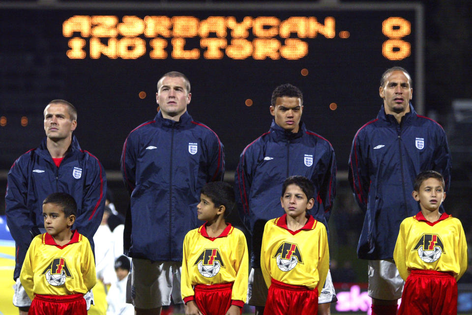 England's captain Michael Owen (l) lines up for the naional anthem for the game against Azerbaijan with l-r Paul Robinson, Jermaine Jenas and Rio Ferdinand (Photo by Matthew Ashton - PA Images via Getty Images)