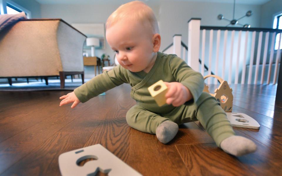 Nine-month-old Evan Albert plays at home in Fairview Township on Jan. 25, 2024. The son of Jon and Stephanie Albert, Evan was born through embryonic adoption, with Stephanie carrying and giving birth to Evan.