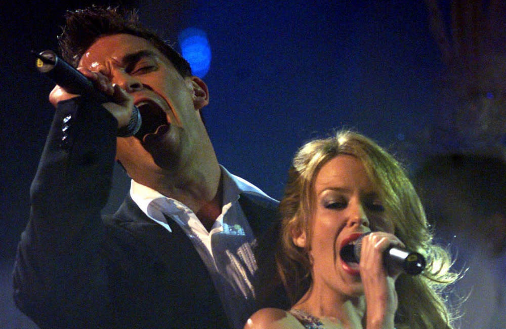 Could Robbie Williams be performing 'Kids' with Kylie Minogue again soon? credit:Bang Showbiz