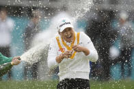 Minjee Lee of Australia is sprayed with champagne by Hannah Green of Australia after winning the BMW Ladies Championship at the Seowon Hills Country Club in Paju, South Korea, Sunday, Oct. 22, 2023. (AP Photo/Lee Jin-man)
