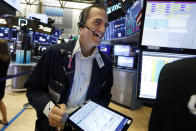 Trader Gregory Rowe works on the floor of the New York Stock Exchange, Friday, Aug. 16, 2019. Stocks are opening broadly higher at the end of a turbulent week. (AP Photo/Richard Drew)