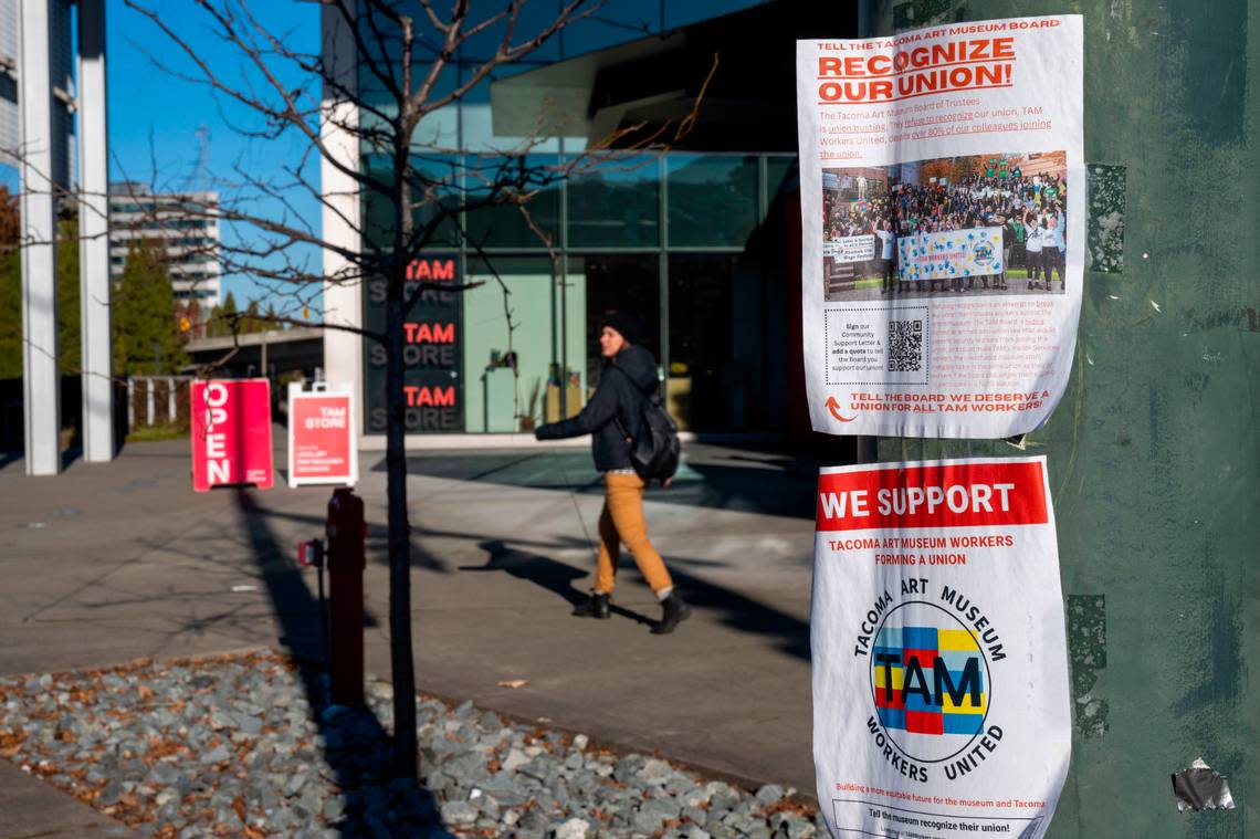 Flyers in support of the Tacoma Art Museum’s union are hung on a streetlight pole outside the museum on Dec. 16, 2022.