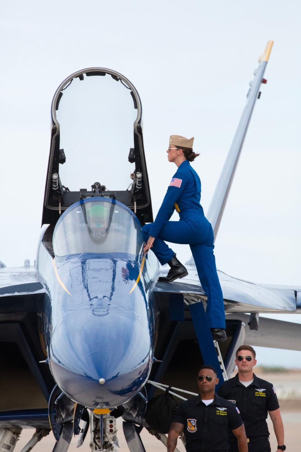 After completing her first public air show performance as a Blue Angel pilot, U.S. Navy Lt. Amanda Lee takes a moment to pose as she exits her F/A-18E/F Super Hornet.