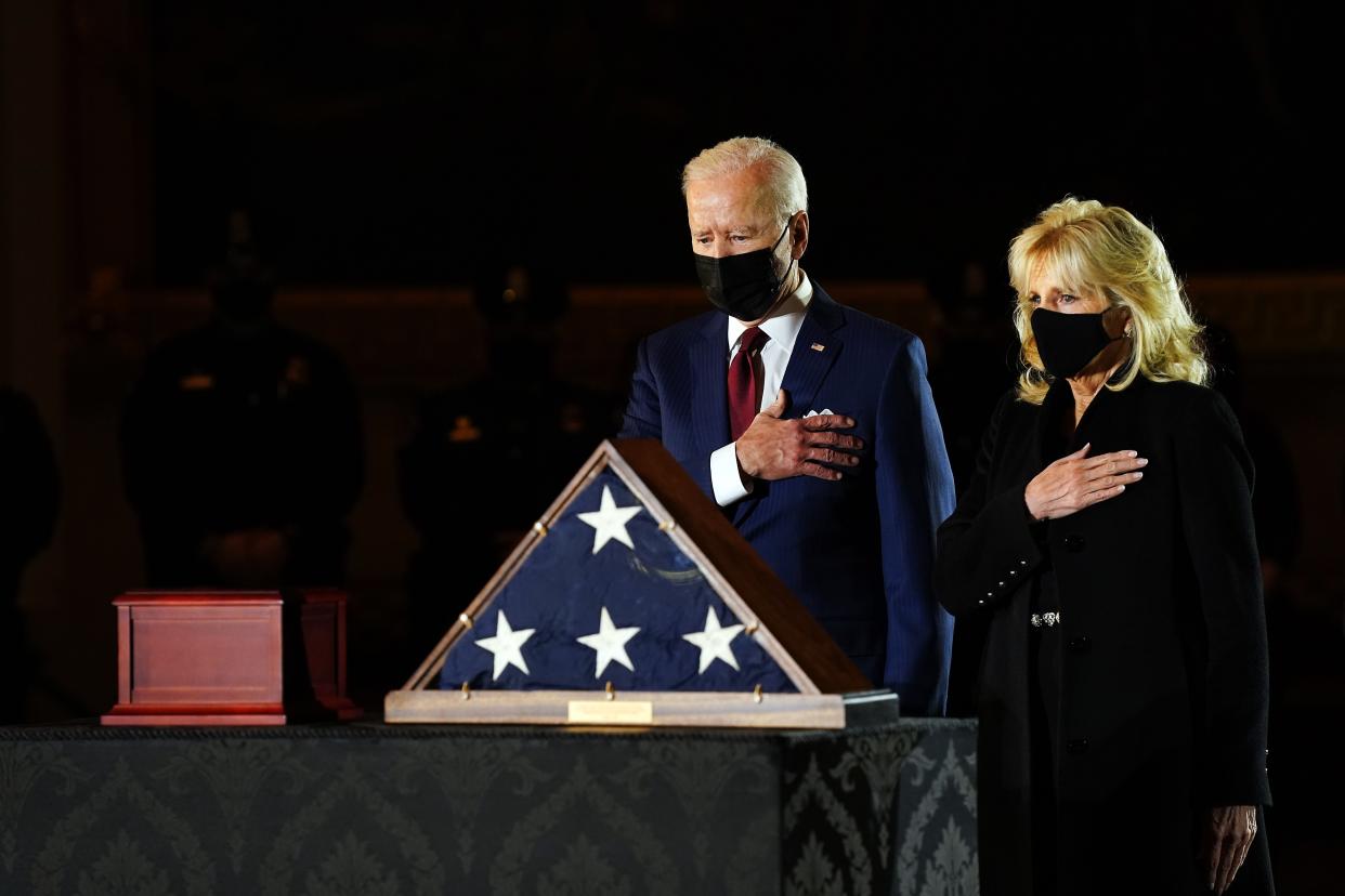 <p>US President Joe Biden and First Lady Jill Biden pay their respects to late US Capitol Police officer Brian Sicknick, as he lies in honor in the Capitol Rotunda in Washington, DC February 2, 2021</p> (Photo by ERIN SCHAFF/POOL/AFP via Getty Images)