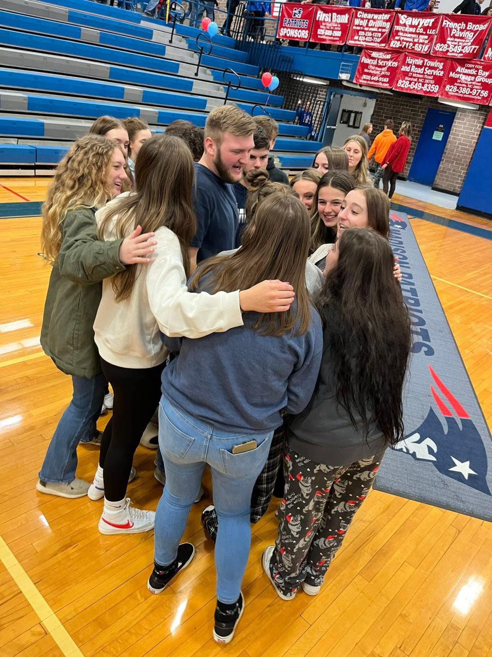 Madison High students celebrate with Spanish teacher Rachael Ray after the school announced Ray earned N.C. Public Schools' Burroughs Wellcome Fund Western Regional Teacher of the Year.
