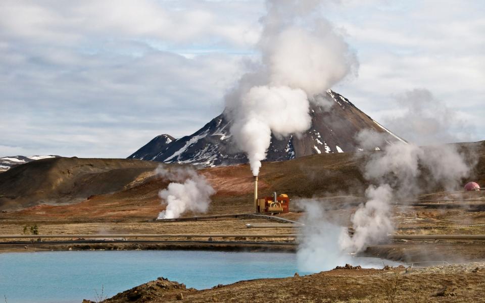 A geo thermal power plant in Iceland blows out steam  - Moment Open