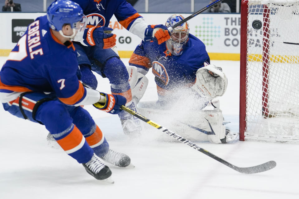 New York Islanders goaltender Semyon Varlamov (40) deflects a shot by New York Rangers' Pavel Buchnevich, not seen, during the first period of an NHL hockey game Tuesday, April 20, 2021, in Uniondale, N.Y. (AP Photo/Frank Franklin II)