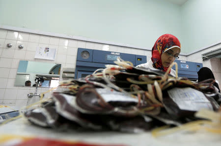 Employees register bags of blood at a blood transfusion centre in Sanaa, Yemen August 7, 2017. Picture taken August 7, 2017. REUTERS/Khaled Abdullah